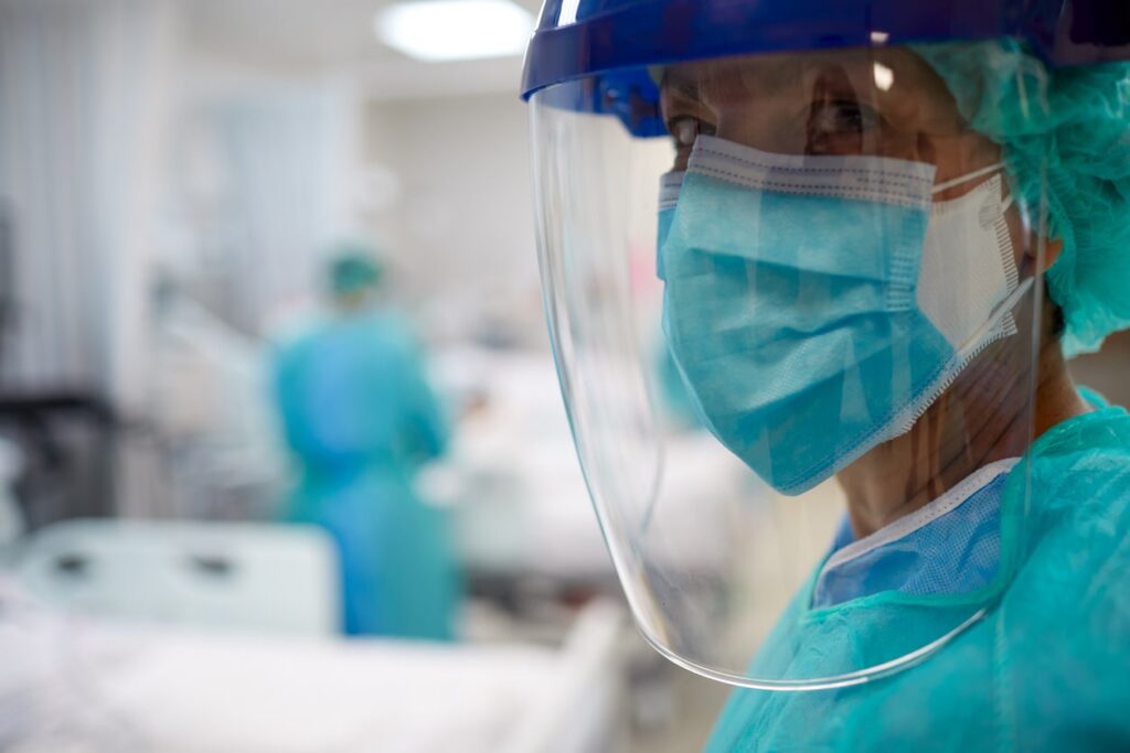 Nurse wearing face visor - environmentally friendly NHS
